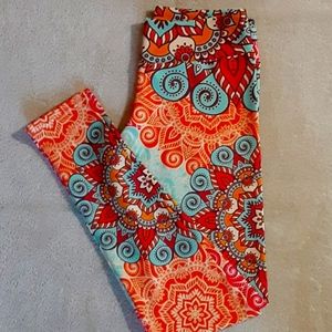 Orange and teal design leggings. Pyramid. Worn maybe once.
